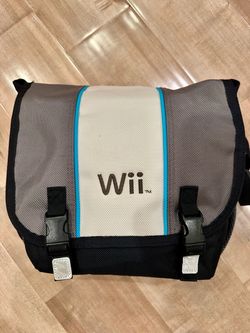 Nintendo Wii in travel case, with 4 controllers and games