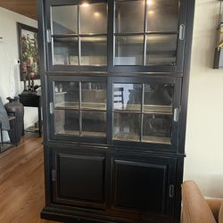 Black Hutch display cabinet located near Gladstone