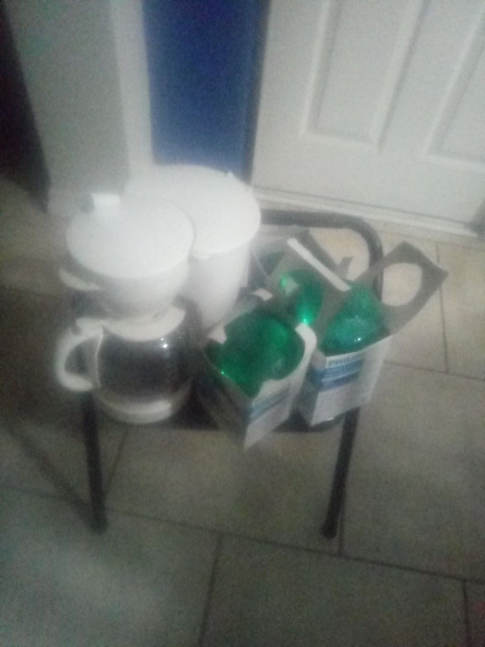 Three bulbs one stool and one coffee pot