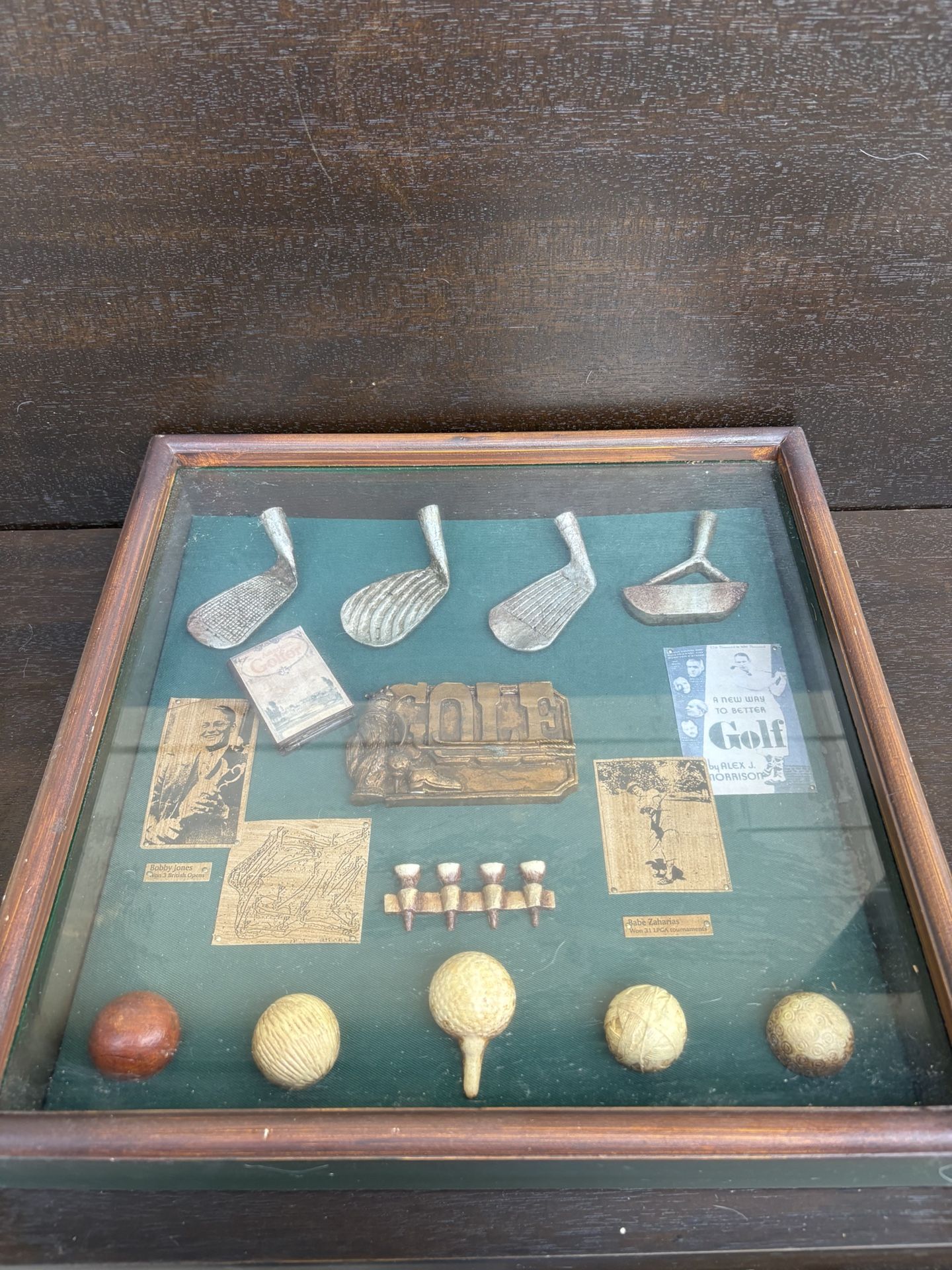 Vintage shadow box display of golf memorabilia