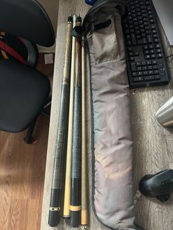 meucci and action playing pool cues with 2 shafts