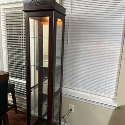 Brown buffet with glass sides and 4 rows in great condition.