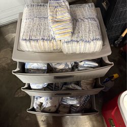 Over 100 xl nite time diapers and cabinet