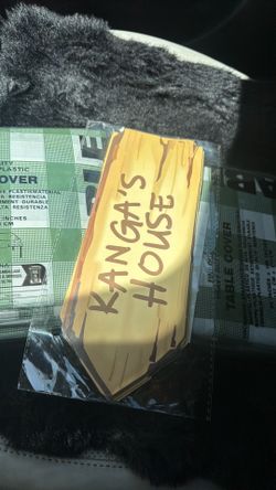 Sage/green checkered table cover plus Winnie Pooh Pooh sign