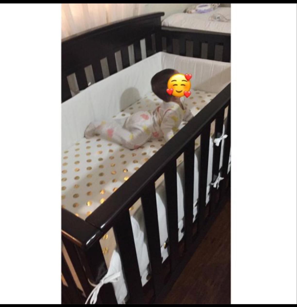 Selling baby crib with a new liner white color and more.