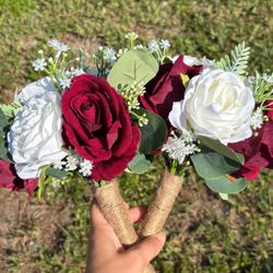 Two faux rose bouquets with eucalyptus