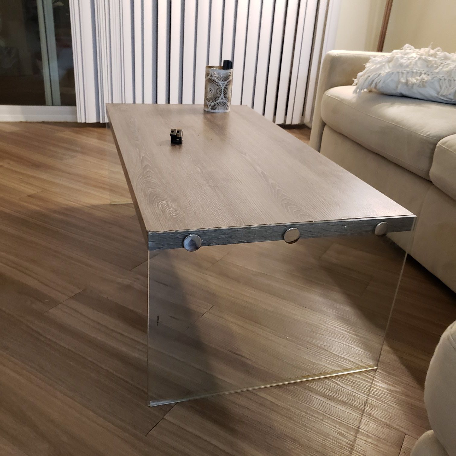 Sleek minimalist look coffee table. Glass sides.