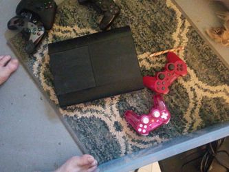 PlayStation 3 with two controllers