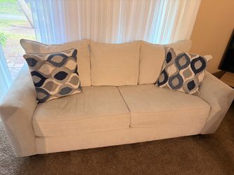 Cream Fabric Two-Seat Sofa with Throw Pillows
