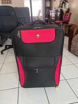 Large 4-wheel suitcase in good condition; measures 30 inches high, 18 1/4 inches wide, and 9 inches deep.