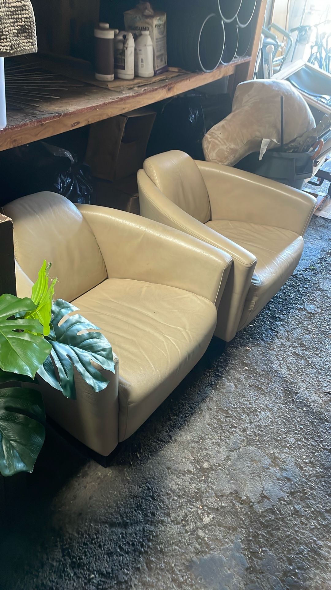 2 Tan Designer Lounge Chairs