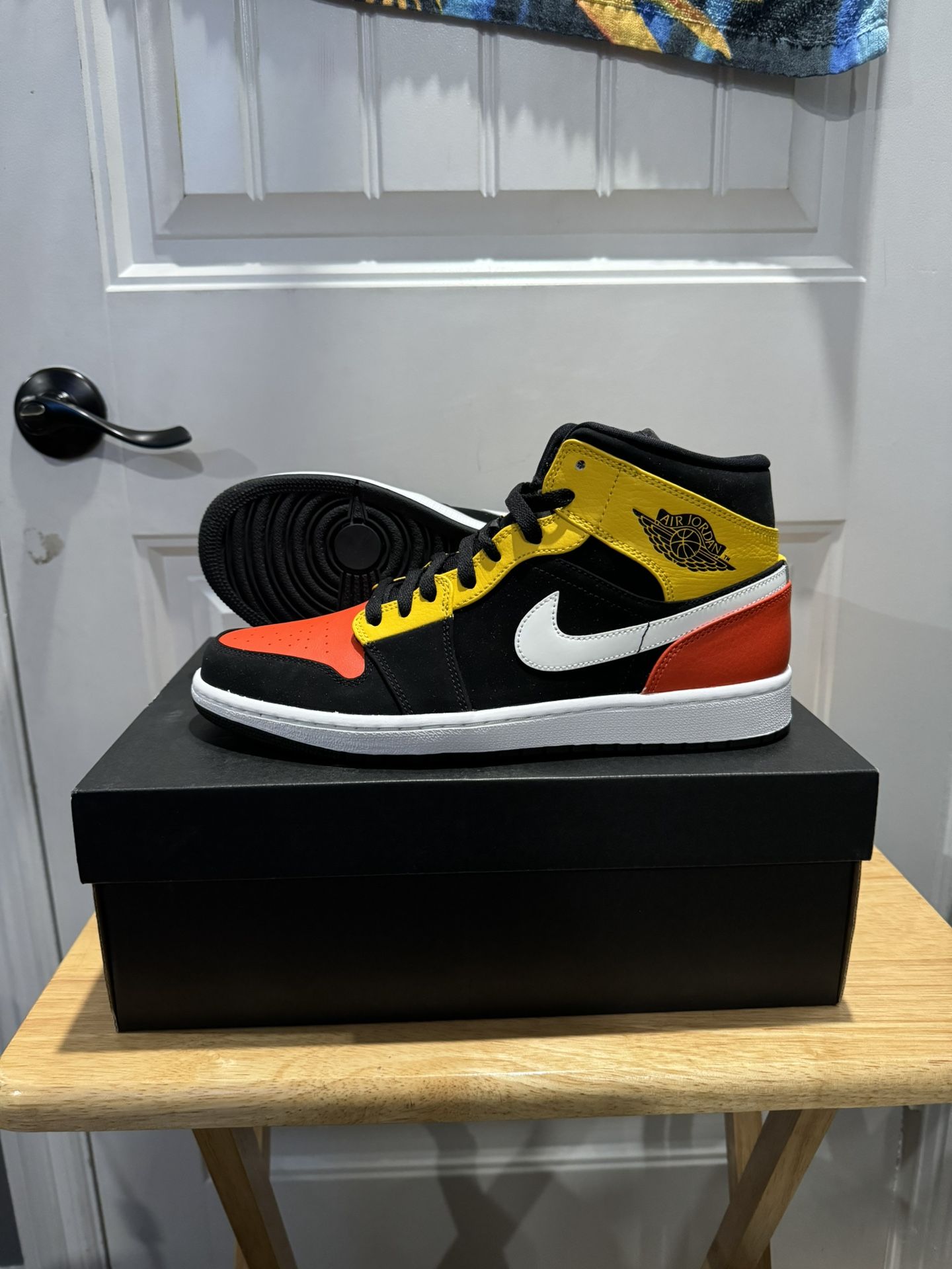 Jordan 1 Mid Black Amarillo Orange