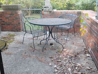 Wrought iron table with 2 chairs