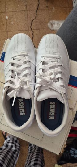 K Swiss.  Size 11  and a half.  White shoes