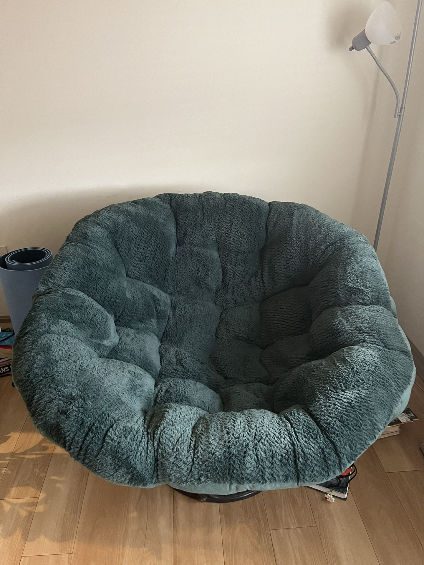 Papasan basket chair with green faux fur cushion