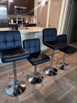 Four Matching Swivel Barstools