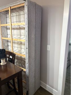 Two twin box springs and king size bed frame.
