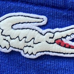 LACOSTE Hoodie with 2 Side Pockets and Glow In The Dark Lacoste Logo. Like New! Size XL. Blue & Black Color