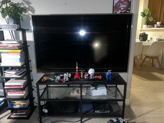 Samsung Large Flat Screen TV and table