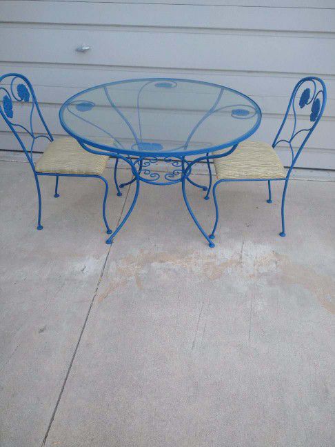 Metal Table Set. Glass top. Reupholstered Chairs. Table Is 41" Diameter. Can Help Deliver