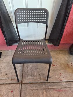 Black plastic chair with metal legs