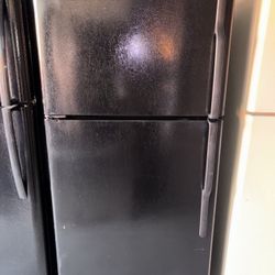 Black GE Refrigerator And Freezer