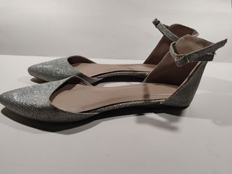 Silver glittery flat with ankle straps