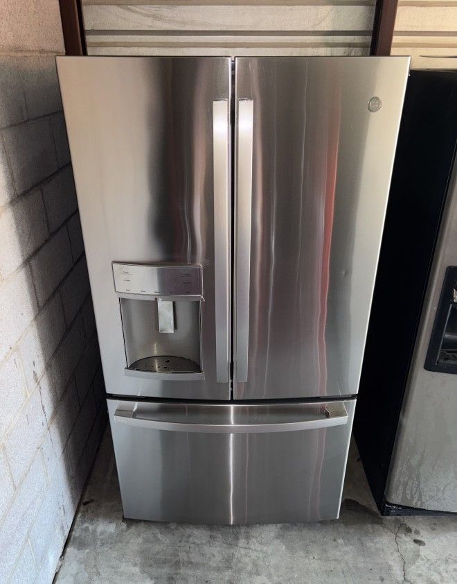 GE Stainless Steel Refrigerator And Freezer