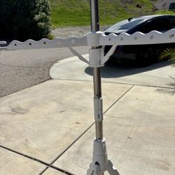 Display Three Tired Clothes Hanging Rod. 