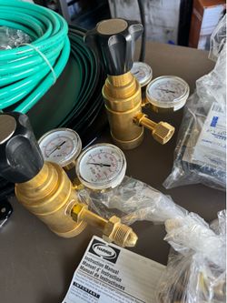 Single stage & multi stage compressed gas regulators  , hoses all fittings brand new $500
