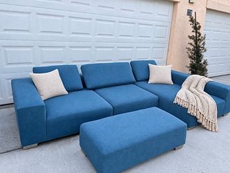 Sectional + Ottoman In a Modern Teal Blue