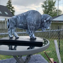 The old grey buffalo statue