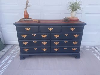 Solid wood navy seven drawer dresser. Delivery available