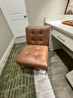 Armless Accent Chair, Faux Brown Leather.