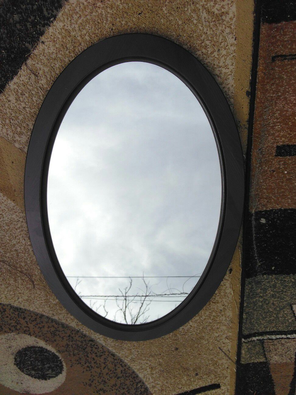 Mirror in Oval Frame.