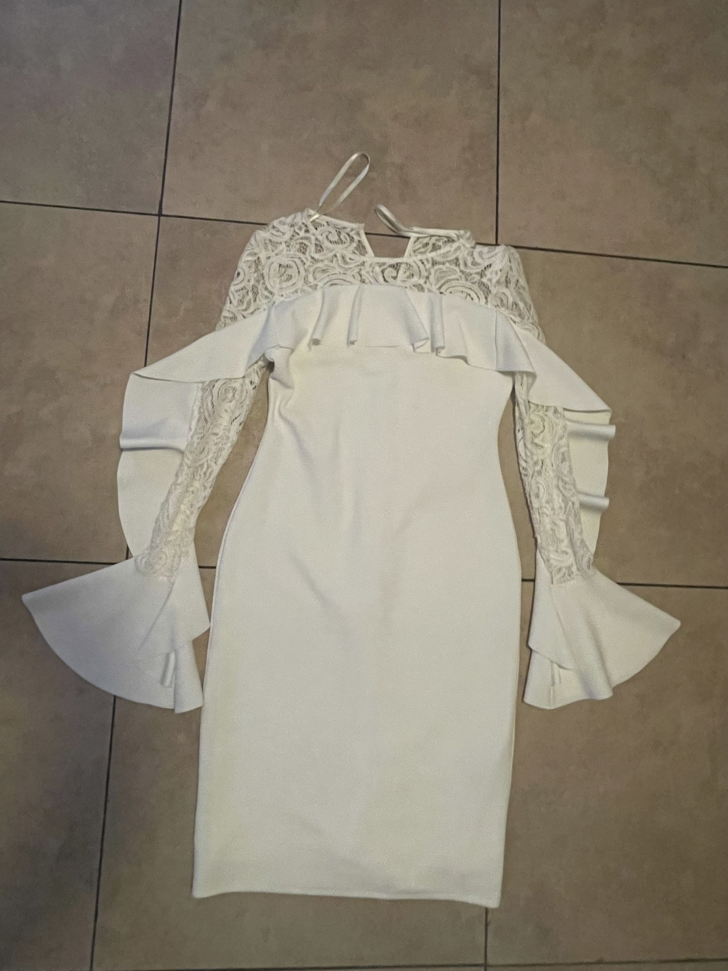 White lace dress with ruffles