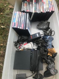 Slim PlayStation with two controllers and all the games she’ll pictures everything goes for $180 asshole horsepower dad