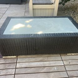 Used - frosted glass, wicker coffee table. 