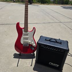Electric Guitar Fender stratocaster with amp and stand.