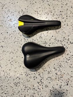 Two Black Bike Saddles
