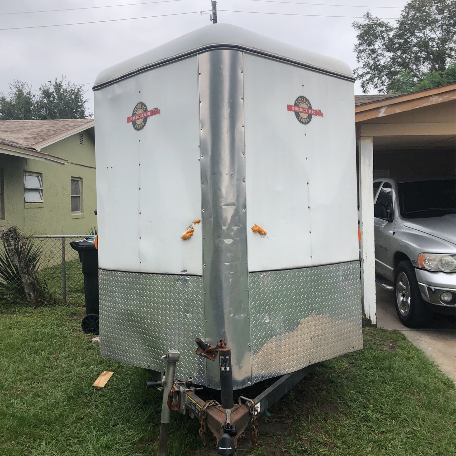 Carry-on cargo trailer Nice marker lights all the way around good tires side door let down ramp back door 2 1/2 inch ball hitch clean title clean regi