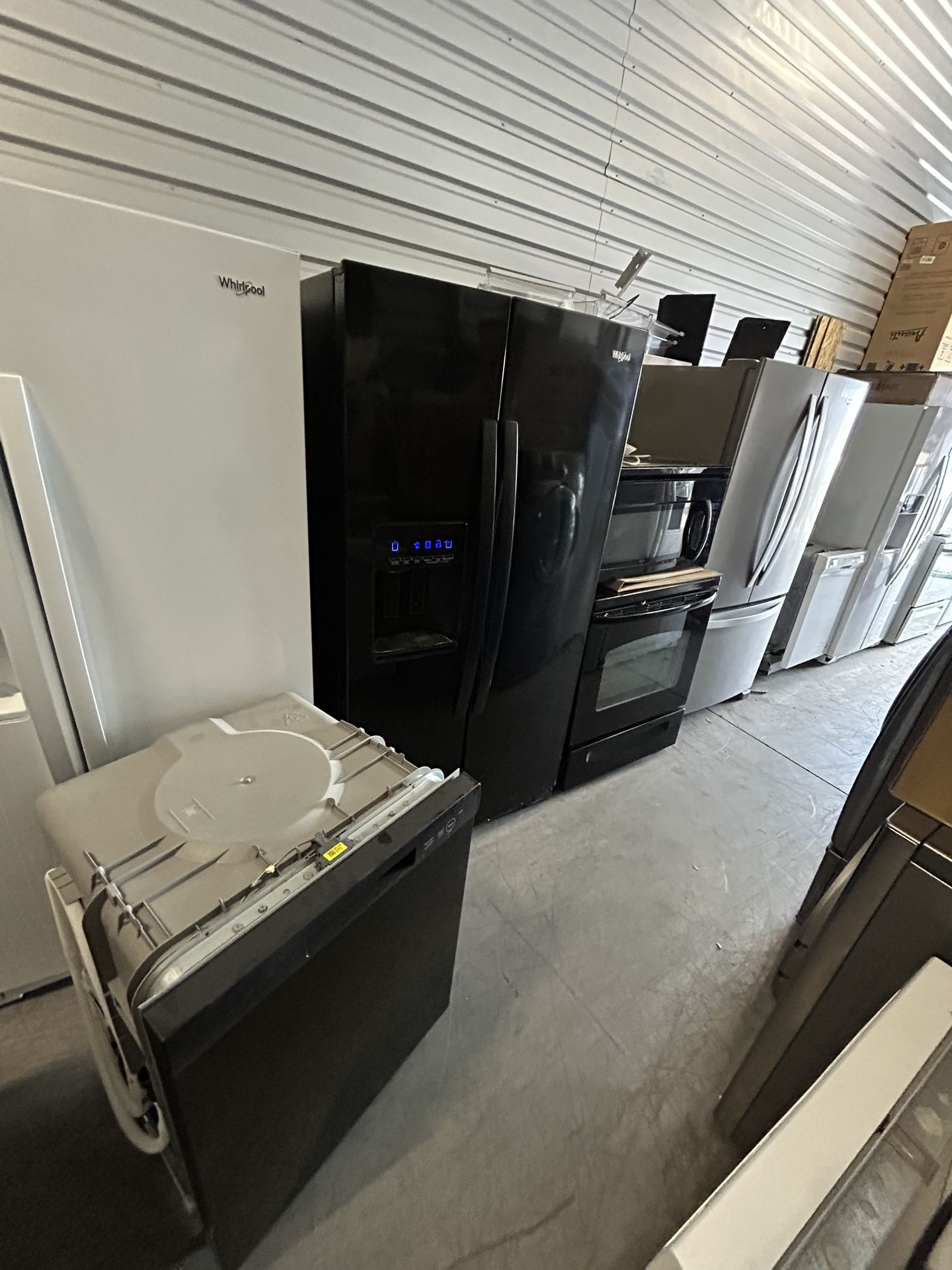 Black appliances, refrigerator, stove, microwave dishwasher
