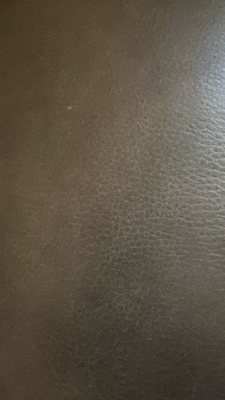 Brown leather, wraparound couch