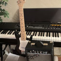 A guitar and an amplifier for a child.