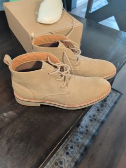 These appear to be tan faux-suede chukka boots detailed with light contrast stitching and matching laces