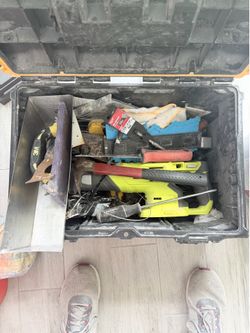 Various tools with a battery operated saws all, and stackable DeWalt box