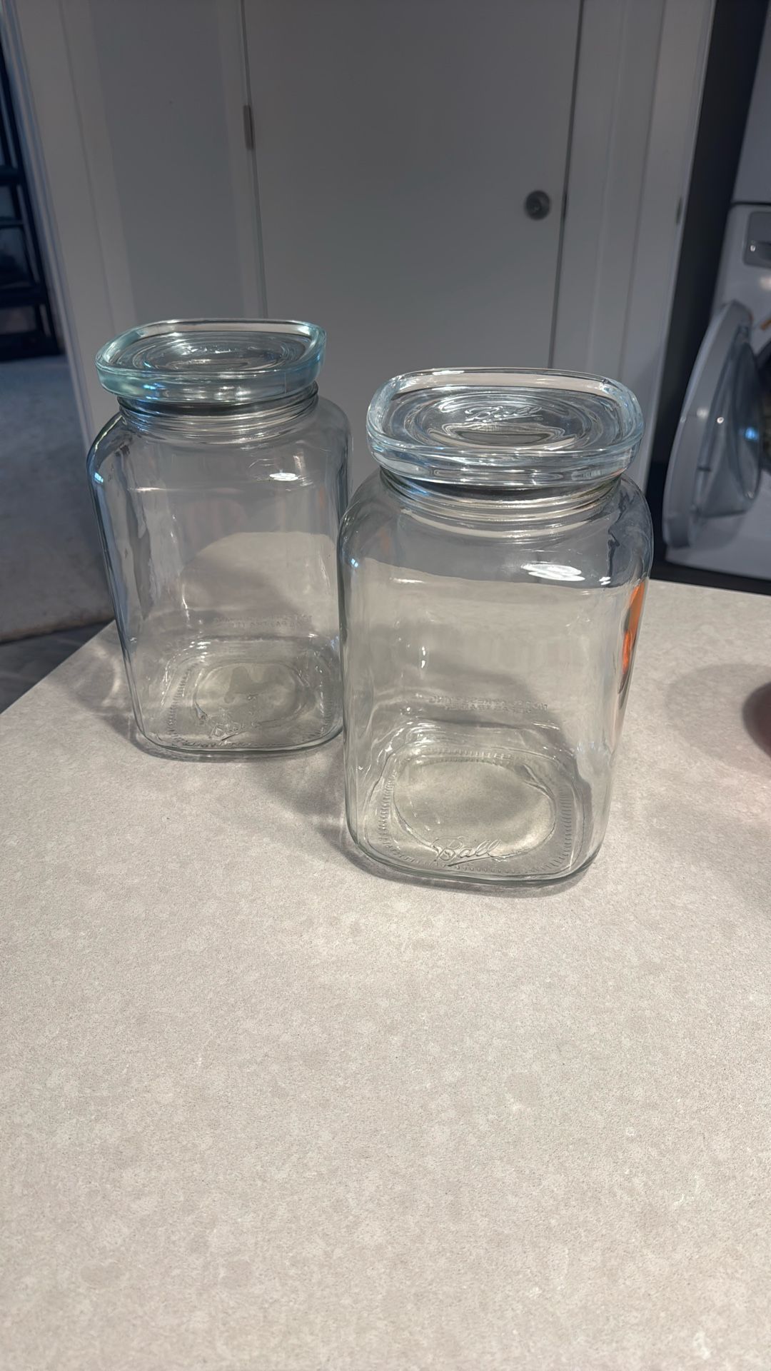 Two 10 Gallon Glass Ball Jars