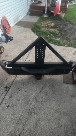 Spire tire carrier