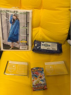 2 rain ponchos, 2 weather proof outdoor blankets, 1 Pokemon pack