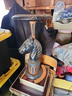 This vintage floor ashtray stand features a decorative black cast metal horse head mounted on a wood and metal ba